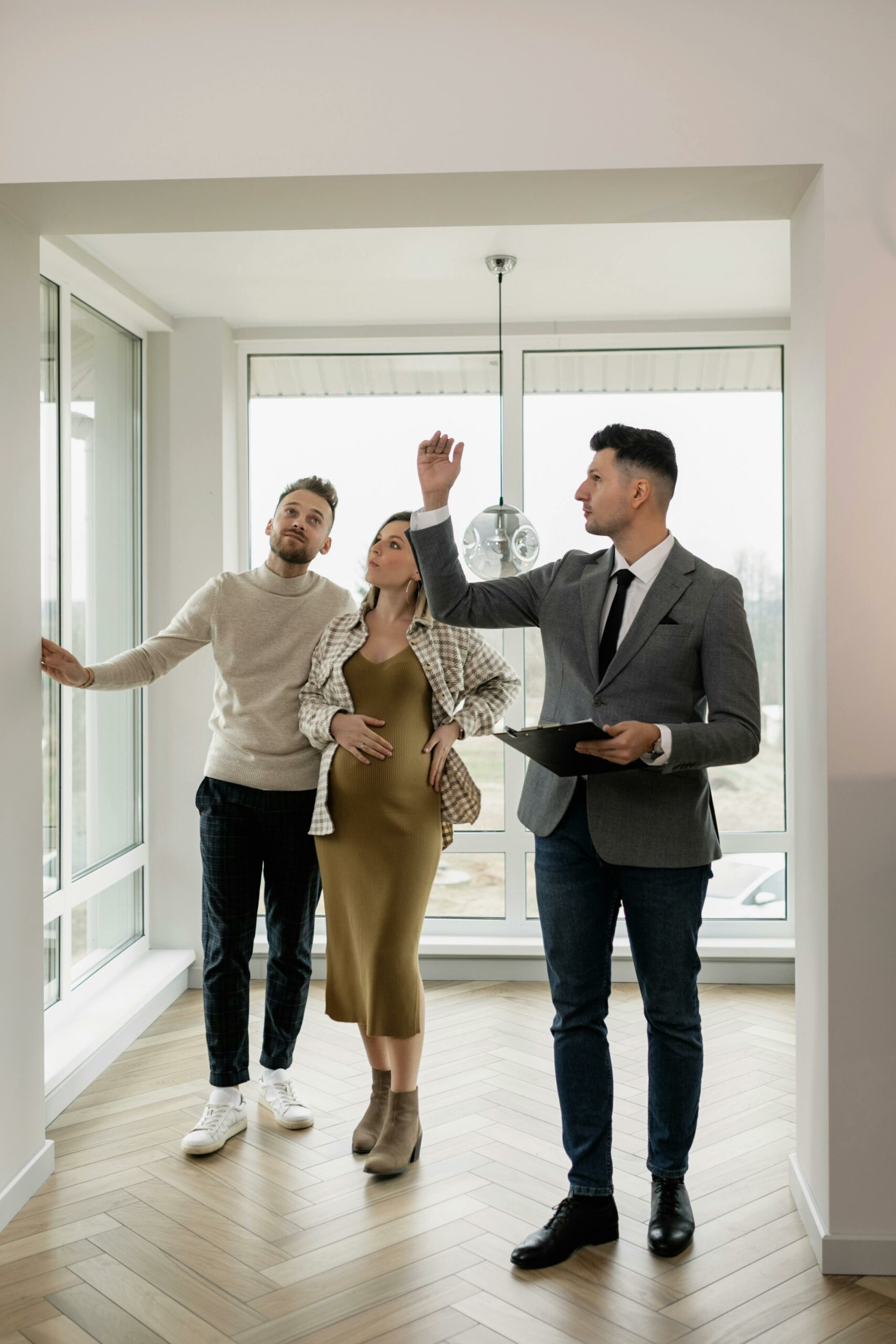 realtor showing potential buyers a new home