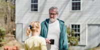 neighbors chatting about house cleaning group discounts at Tidy Bird Cleaning