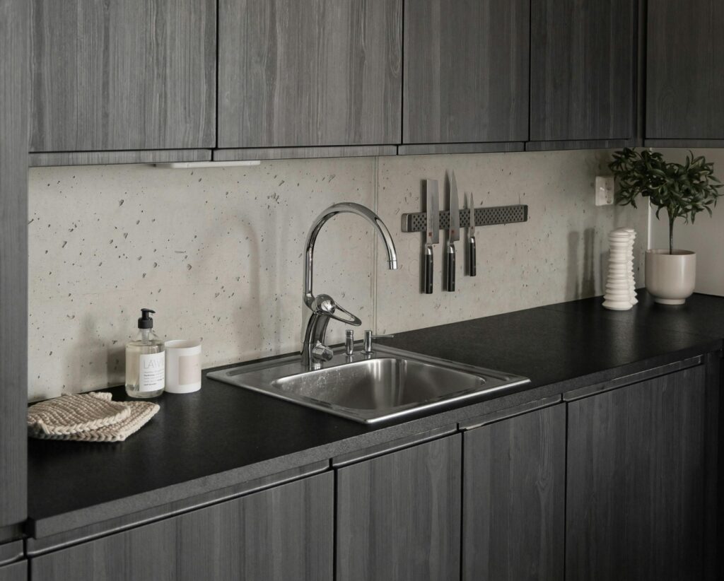 beautiful kitchen with stainless steel sink and faucets