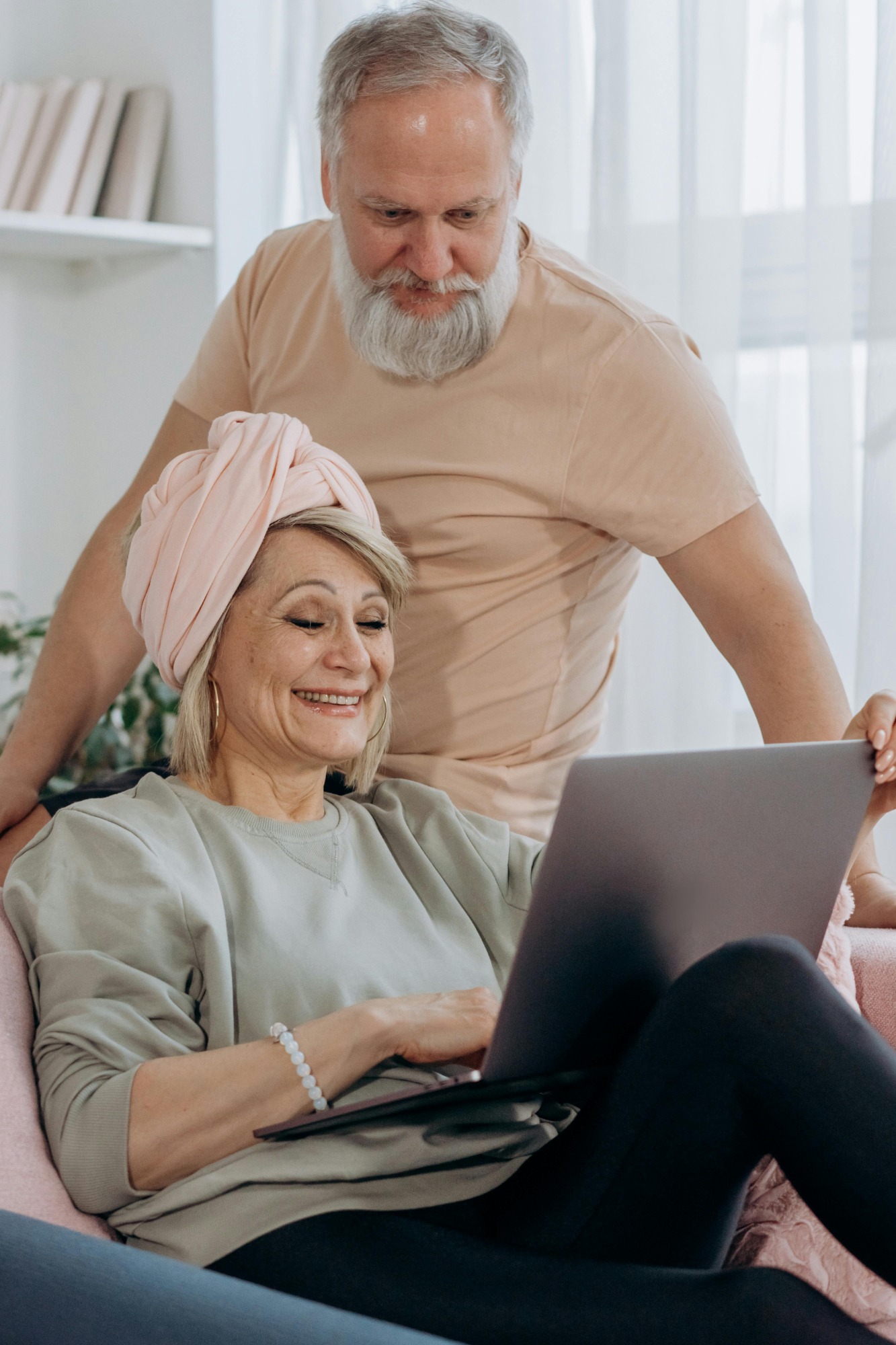 Happy seniors booking house cleaning services online from Tidybirdcleaning