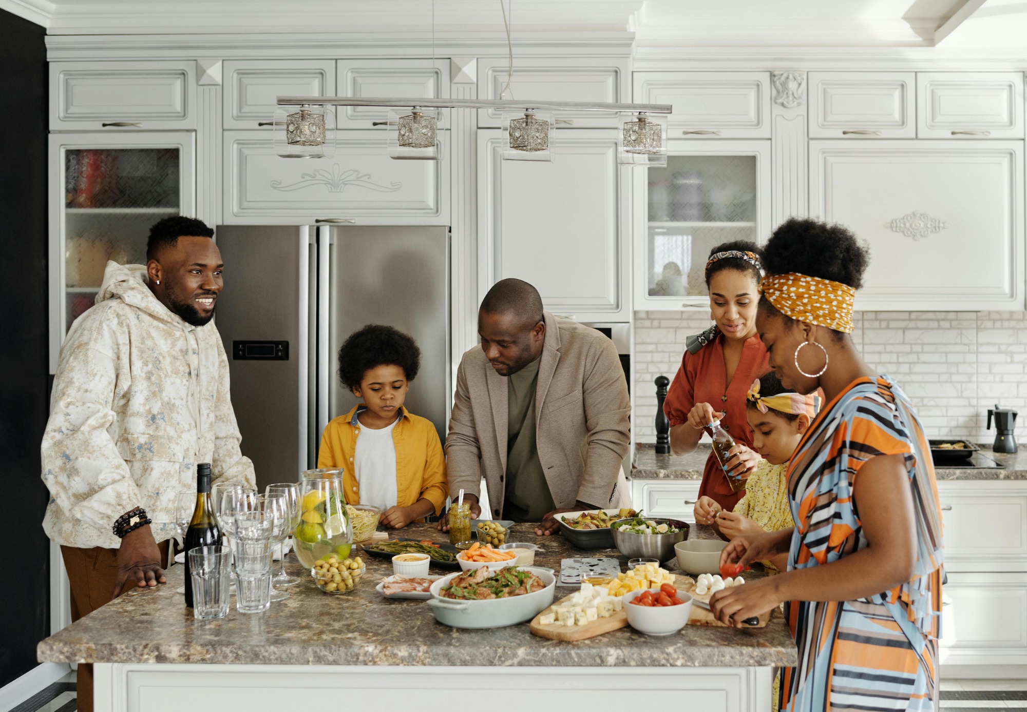 Happy Black family making dinner in a clean kitchen
