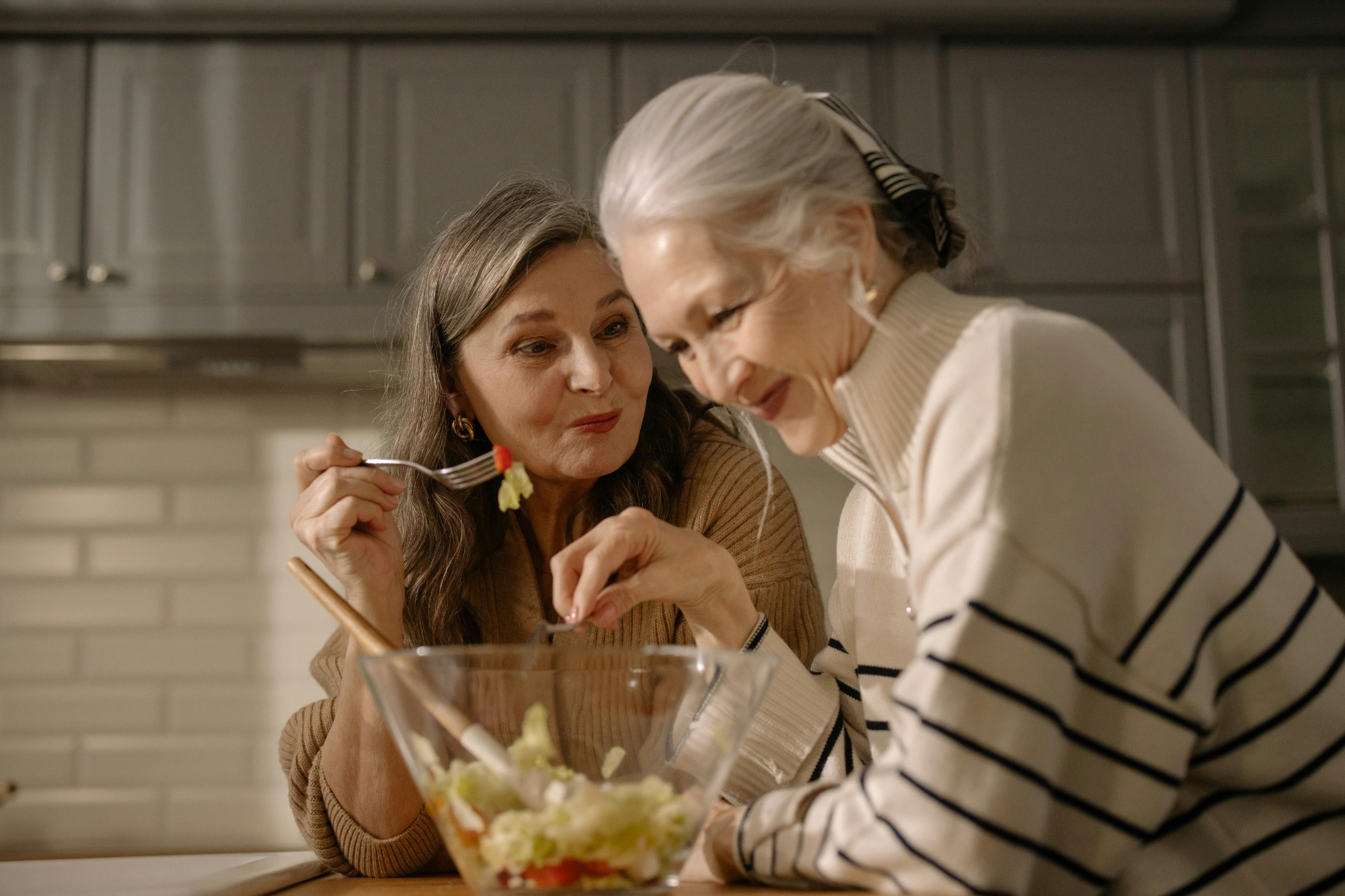 seniors hanging out eating salad