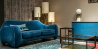 blue velvet comfy couch in a clean living room - tidybirdcleaning